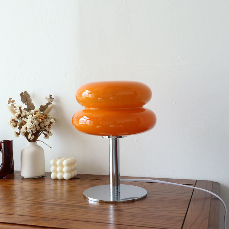 Retro orange glass table lamp with a rounded, two-tier shade on a polished chrome base, 29cm tall.