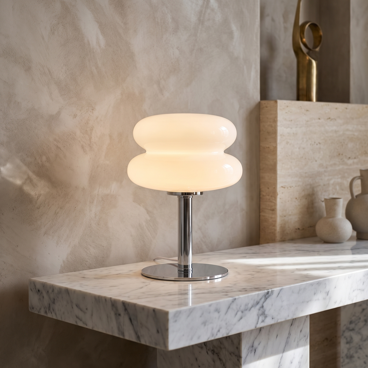 Retro 70s space age table lamp with a glowing white glass shade and polished chrome base on a marble surface.