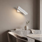 Rotatable LED Wall Light – White in an elegant dining room above a marble sideboard