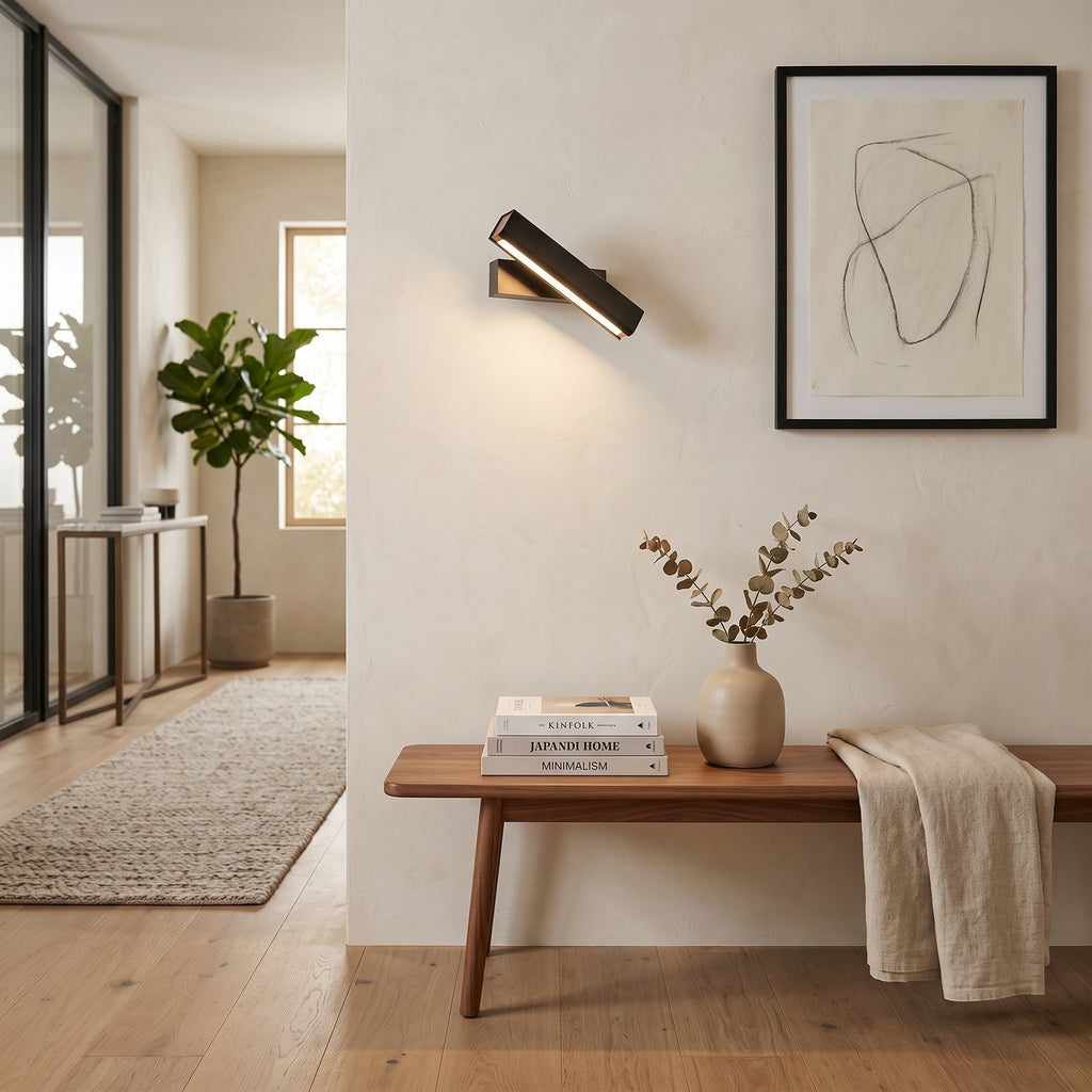 Rotatable LED Wall Light – Black in an entrance hall above a slim walnut bench
