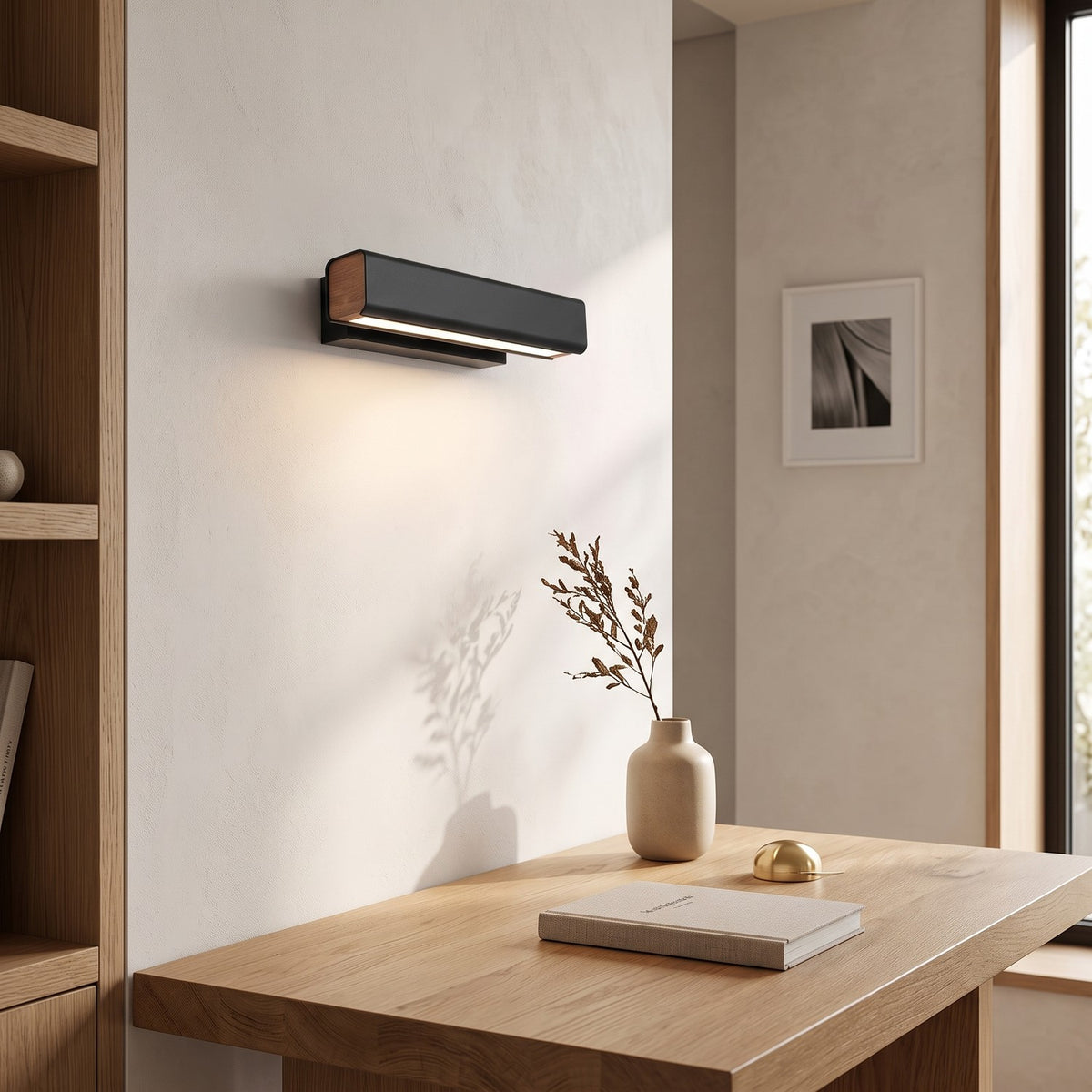 Rotatable LED Wall Light – Black in a calm home office above a solid oak desk