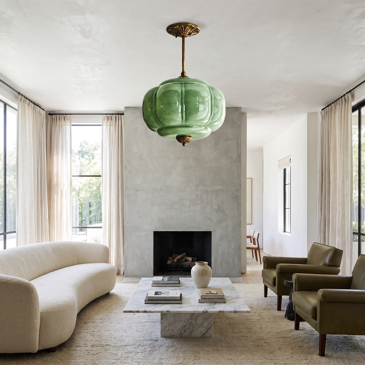 Green sculpted glass semi-flush ceiling light with vintage brass hardware in a modern living room.