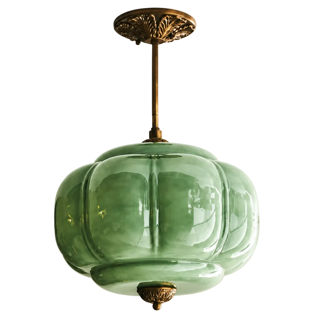 Vintage green sculpted glass semi-flush ceiling light with an ornate antique brass mount and decorative detailing.