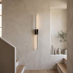 Slim Linear LED Wall Light – Black in a staircase landing with limewashed walls