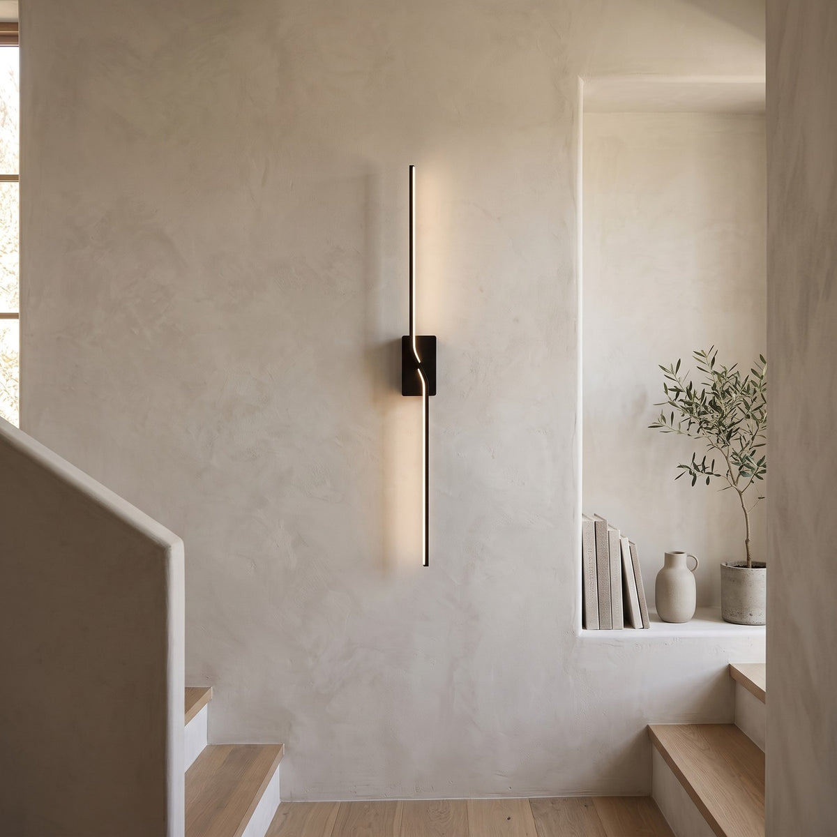 Slim Linear LED Wall Light – Black in a staircase landing with limewashed walls