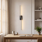 Slim Linear LED Wall Light – Black in a calm home office above a solid oak desk