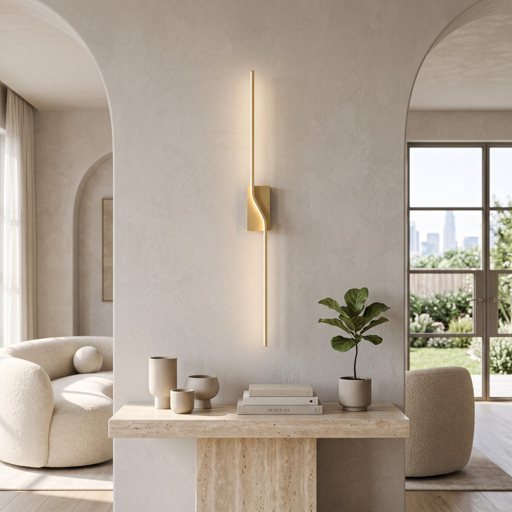 Slim Linear LED Wall Light – Gold in a bright living room above a travertine console