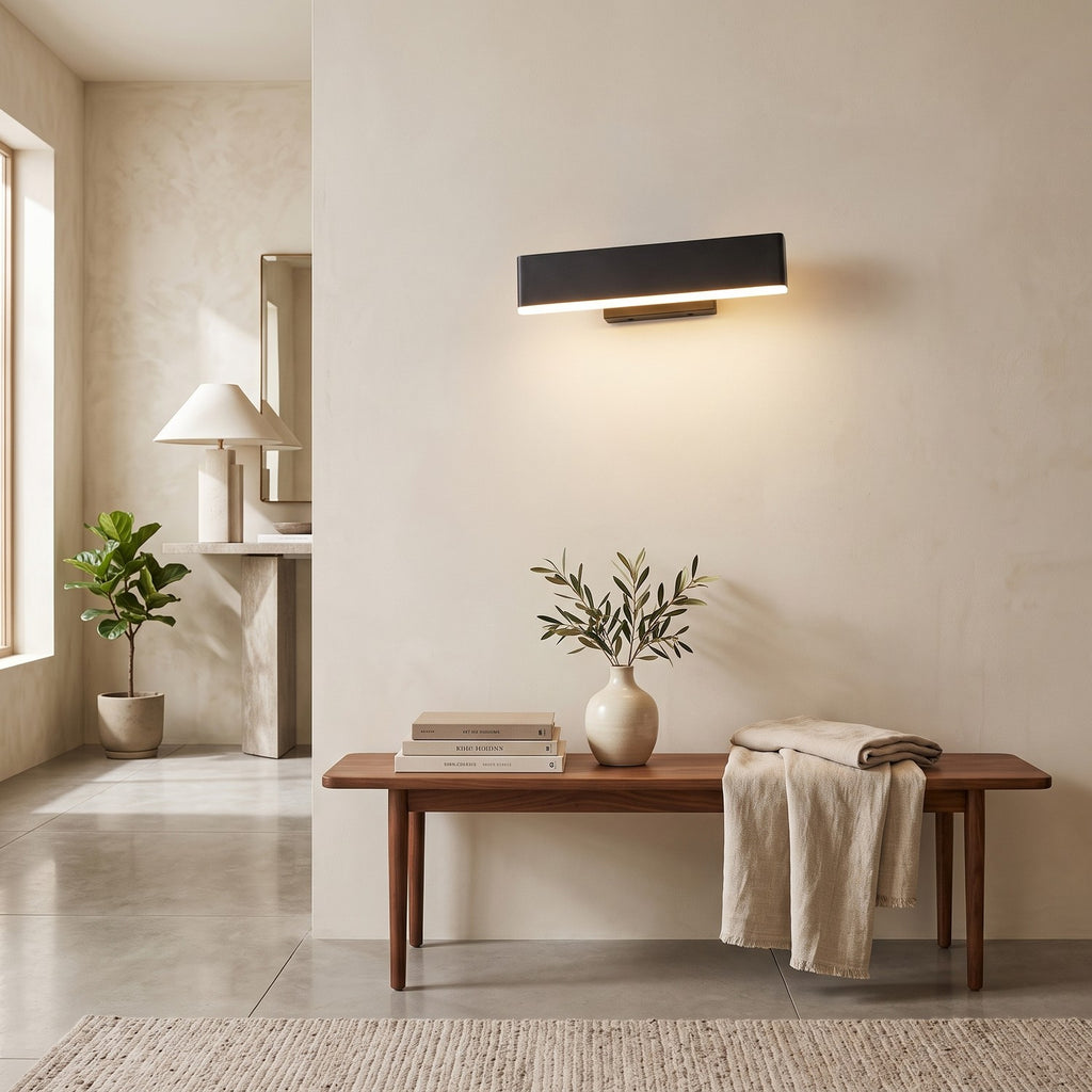 Up Down LED Wall Light – Black in an entrance hall above a slim walnut bench