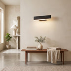 Up Down LED Wall Light – Black in an entrance hall above a slim walnut bench