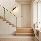 Up Down LED Wall Light – Brown in a staircase landing with limewashed walls