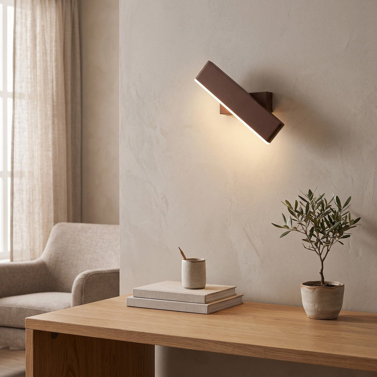 Up Down LED Wall Light – Brown in a calm home office above a solid oak desk