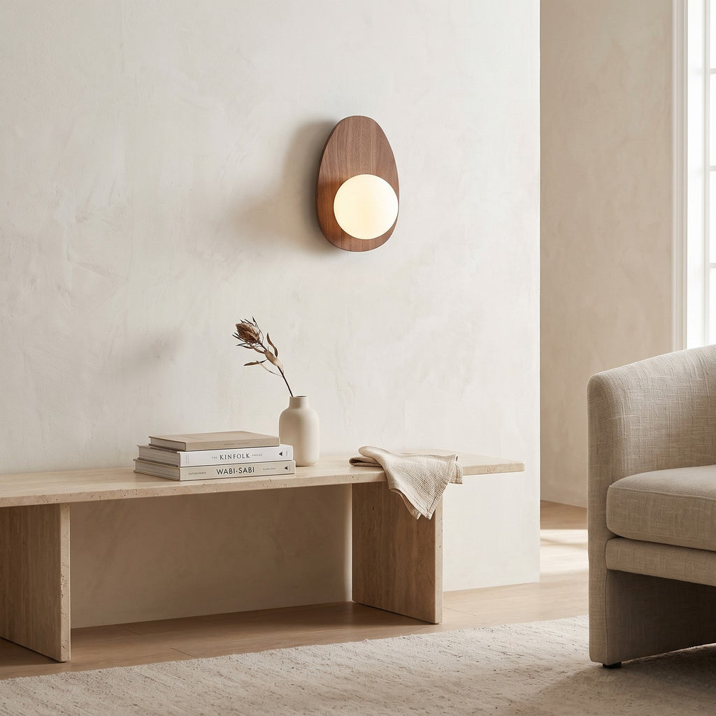 Walnut Wood Wall Light in a bright living room above a travertine console