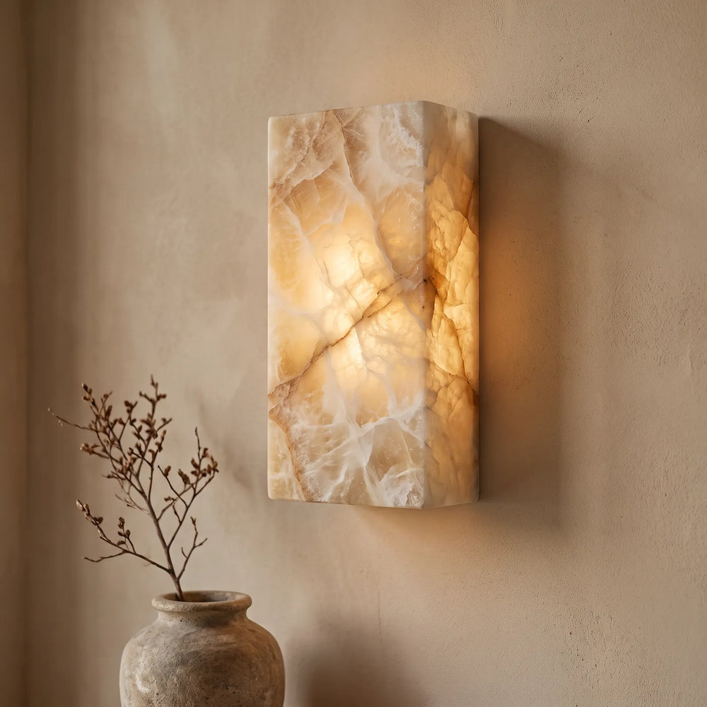 Alabaster wall light with natural veining glowing from within